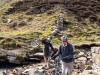 Oz and Simon crossing the beck in Gunnerside Gill